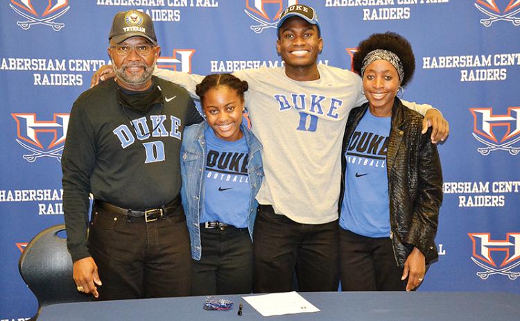 Habersham Central’s Joshua Pickett is joined at his signing ceremony Wednesday by his dad Harold, sister Kaylin and mom Angelia.