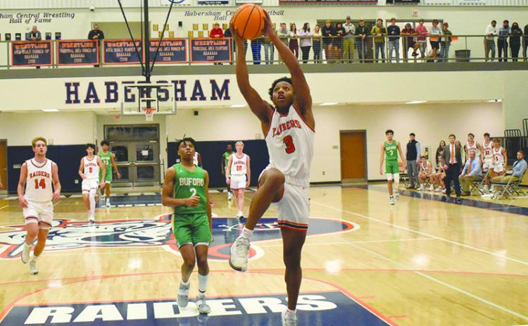 Habersham Central’s guard Malachi Dooley elevates for a layup against Buford in December.