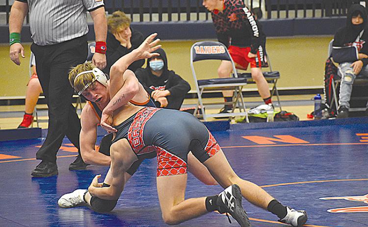 Habersham Central’s Eli Pilgrim prepares to flip his Winder-Barrow opponent on the way to a pinfall victory during Saturday’s area duals.