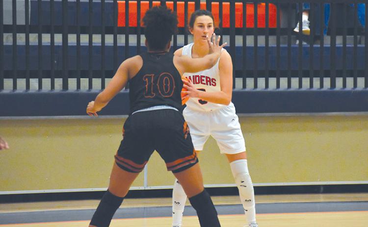 Addie Penick looks to make a play in a recent Lady Raider victory over Lanier. HCHS fell Tuesday night to region-leader Buford 49-36 in a contest that came down to the fourth quarter.