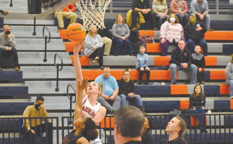 Habersham Central’s Taylor Wade drives to the hoop during Friday night’s win over Lanier.
