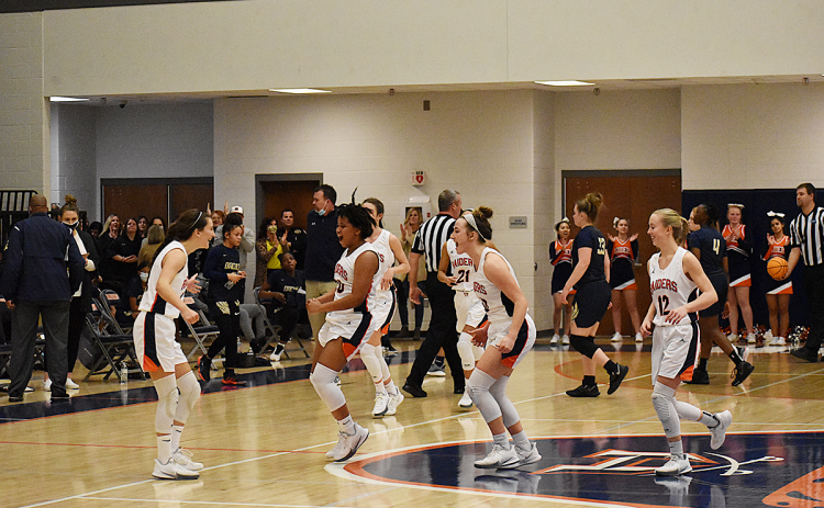 Habersham Central Lady Raiders players celebrate after their win over Dacula