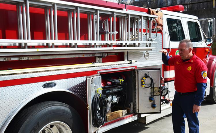 Demorest Fire Chief Ken Ranalli explains the ins and outs of his ladder truck.