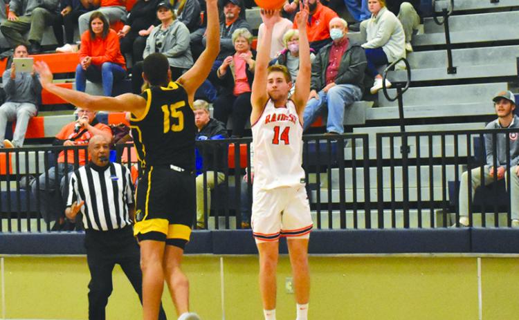 Habersham Central’s Grant Tipton launches a 3-pointer over Central Gwinnett’s Osiris Shabazz on Friday night.