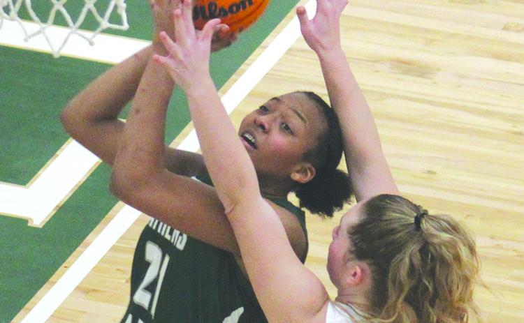 The Lady Indians’ Abby Carlan defends Athens Academy’s India Sheats under the hoop. ANDY DIFFENDIRFER/Clayton Tribune