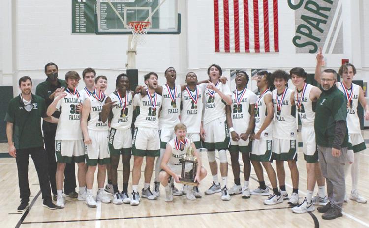 Tallulah Falls captured its first region championship in program history Wednesday night, beating George Walton 64-47. Pictured are (front) Kale Corbett, (back from left) head coach Cody Coleman, assistant coach Lowell Hamilton, Colton Hicks, George Ketch, Lincoln Hall, Simeon Respress, David Rodriguez, Anfernee Hanna, Sammy Davis, Gabe Keene, Devonte Allen, Julian Gober, Diego Crotta, Bryan Cope, assistant coach Matt Crotta and Charlie Cody.
