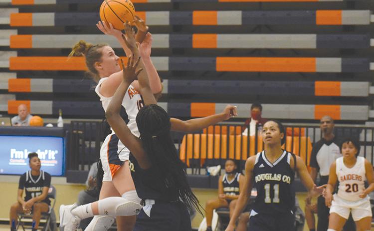 Habersham Centra's Taylor Wade drives hard to the hoop against Douglas County. CODY ROGERS/Staff