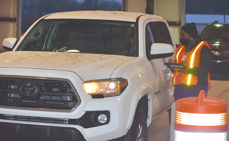 The first car gets checked in at the Habersham County mass vaccination site Monday morning in Clarkesville.
