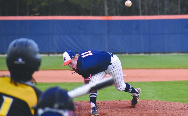 Austin Jones (11) delivers a pitch to Central Gwinnett’s Justin Johnson during a recent home game. In game one against Buford, Jones held the Wolves’ bats at bay to keep the Raiders in the game heading into the sixth inning.
