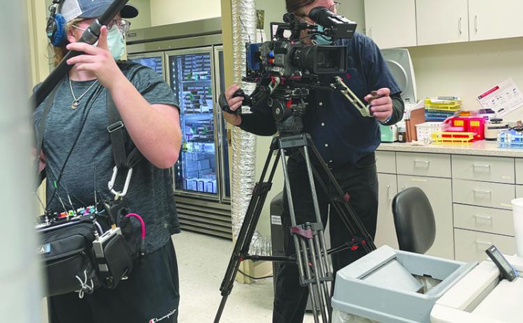 Habersham Central senior Carter Marsengill (left) works with the crew filming Friday at Habersham Medical Center for a feature story on 60 Minutes-Plus.