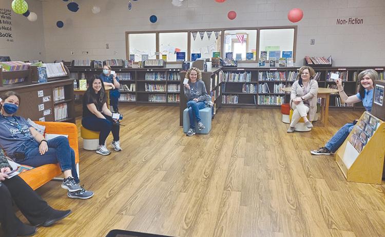 Clarkesville Elementary staff members LaDonna Canup, Lauren Fair, Brenda Falck, Allison Boykin, Tara Brookshire and Marie Benfield show off their vaccination cards. HABERSHAM COUNTY SCHOOLS/Submitted