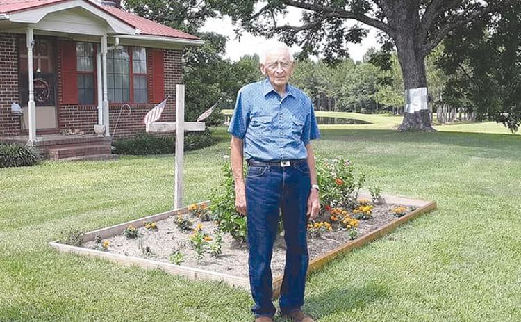 Sandy Turner’s father, James Thompson of Wrightsville, passed away due to COVID-19  in January.  At his funeral, someone used an old cross as a flower arrangement. She thought it was an appropriate gesture.