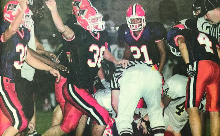 Habersham Central’s Marty Patterson (38) celebrates along with teammates after a big stop during a 2006 game.