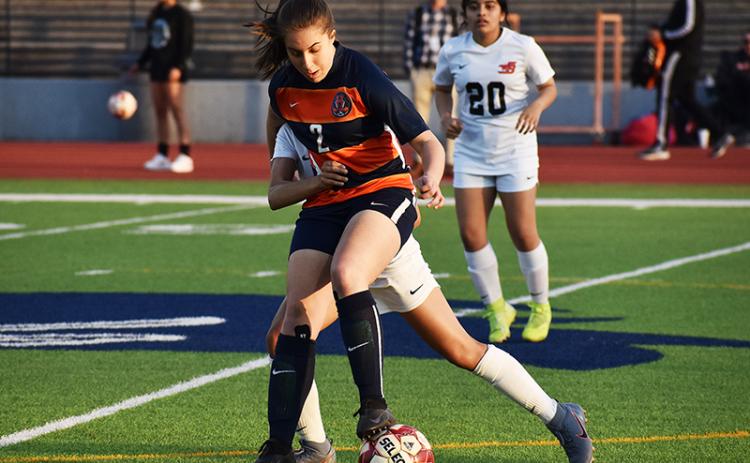 Habersham Central’s Ryalie Acker battles for position against a defender during a home game earlier this season against Winder-Barrow.
