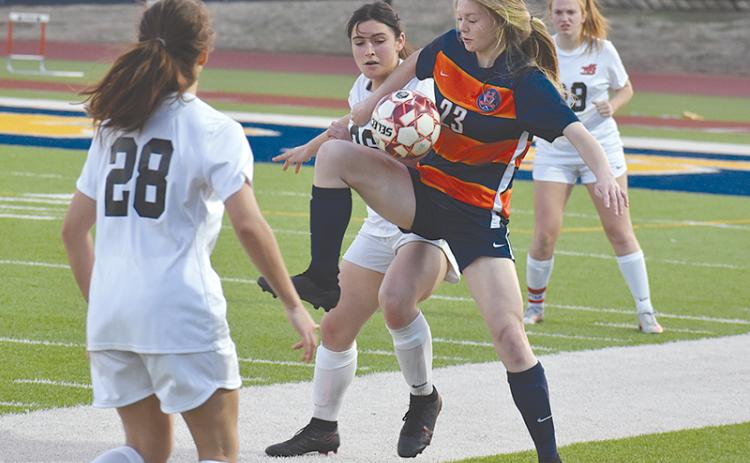 Habersham Central’s Sarah Clark juggles the ball to gain possession during Tuesday’s win over Winder-Barrow.