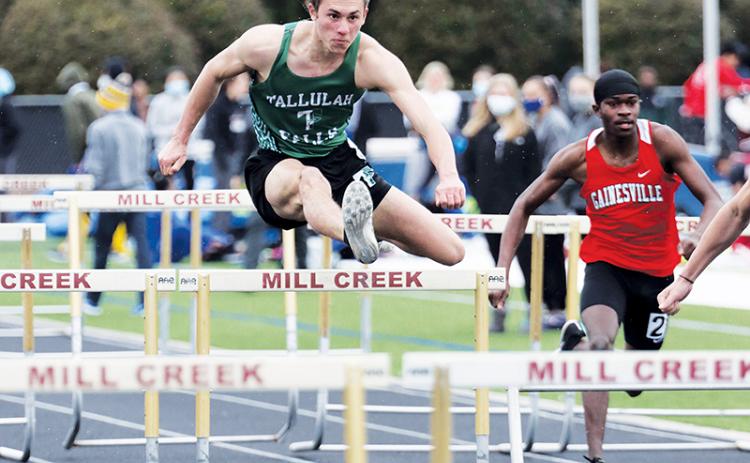 Tallulah Falls’ Grey Bourlet runs the hurdles at Mill Creek.