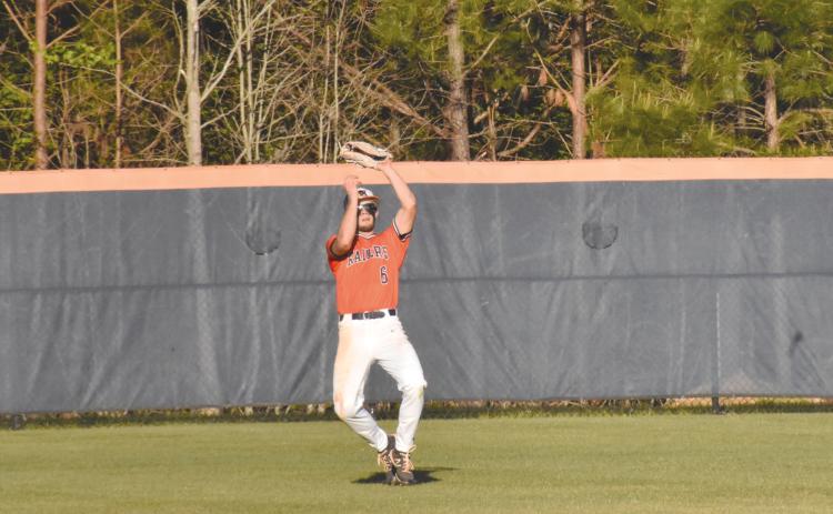 Azzi Cervantes makes a catch in center field during the Raider’s last home game against Lanier. Cervantes had two RBI for HCHS Wednesday night. ISAIAH SMITH/Staff