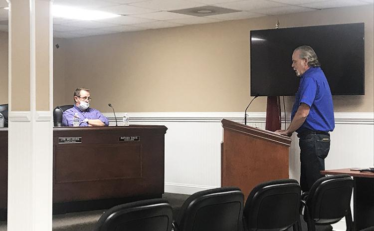 Chuck Miller, vice president for the Marion Body Works fire truck dealer for the state of Georgia, makes a presentation at Tuesday’s Demorest City Council meeting as Councilman Nathan Davis listens.