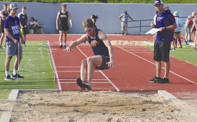 Garrett Heaton takes one of his attempts in the long jump at The Battle of the Blue Ridge at HCHS. Heaton won the event last Friday at the Mt. Yonah Invite.