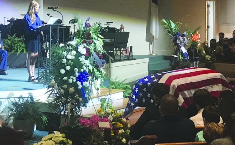 Madison Ball speaks about her love and fond memories of Caleb Griffis on Monday at Level Grove Baptist Church. Caleb died April 1 in a motorcycle accident.