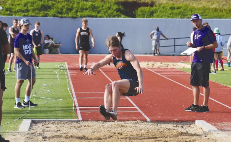 Garrett Heaton takes an attempt in the triple jump during a meet at HCHS. Heaton finished ninth in the event at the state meet last weekend, and he added a fourth-place finish in the 400 meter dash. ISAIAH SMITH/Staff