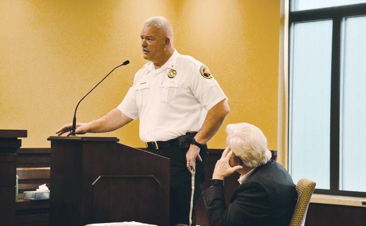 Habersham County Sheriff Joey Terrell speaks as County Manager Phil Sutton listens to his plea for immediate raises for his officers. MATTHEW OSBORNE/Staff