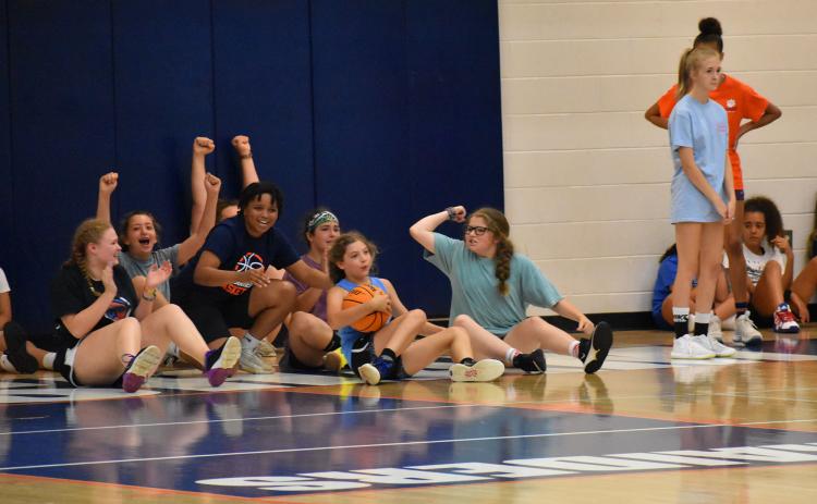 Habersham Central rising senior Nyke Brown shares some fun with some of the participants at Lady Raider basketball camp Wednesday. ISAIAH SMITH/Staff