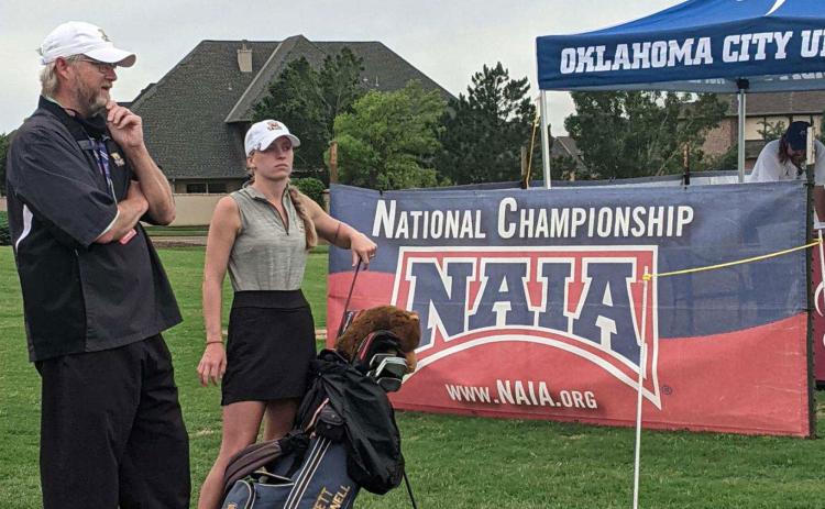 In the school’s first appearance at the NAIA National Championships last week, Truett McConnell senior Kiley Blackburn advanced to the final rounds as an individual, making her the first in program history to do so. Blackburn speaks to head coach Steve Patton during one of her rounds. SHAWN BLACKBURN/Submitted
