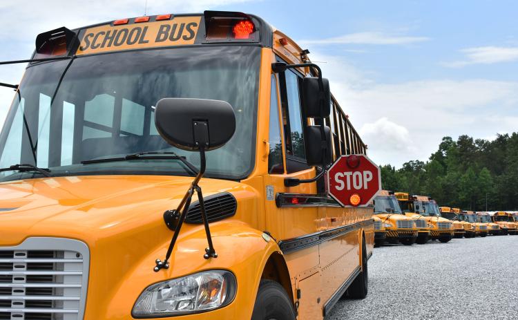 The Habersham County Board of Education is considering a contract with BusPatrol to equip all of its school buses with cameras to deter drivers from passing stopped school buses. Shown are a fleet of buses at the bus shop in Demorest. CHAMIAN CRUZ/Staff