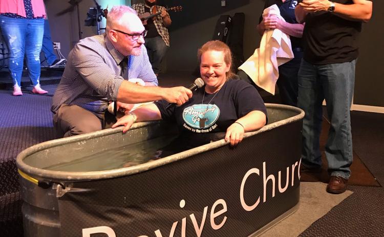 Cassie Kemp says she decided to get baptized after starting her recovery from addiction at Freedom Hill in Demorest. Above, Kemp is baptized at Revive Church. BECKY EASLEY/Submitted
