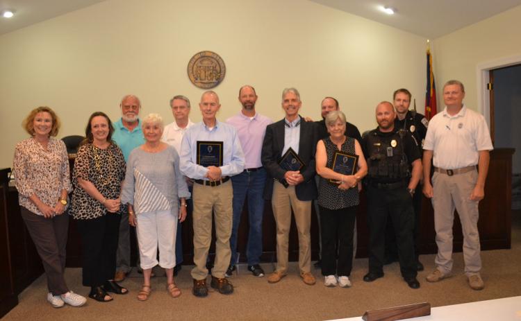 (Front left-right): Council members Roxie Barron, E. Lane Gresham, Mayor Barrie Aycock, Officers Larry Sheffield and Stanley Lovell, Municipal Court Clerk Elaine Waller, Officers Ryan Ledford and Daniel Clouatre. (Back row left-right): Council members Franklin Brown, Terry Gladden, Steven Ward, Police Chief Brad Barrett, and Officer Jamie Bowden. BRIAN WELLMEIER/Staff