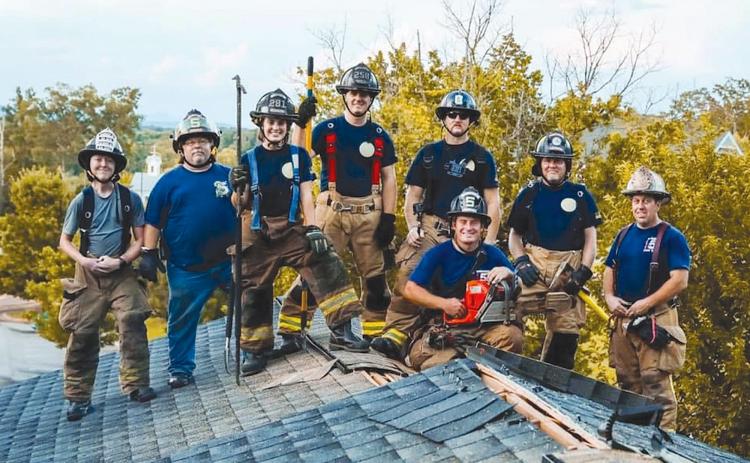 Firefighters from Demorest and Cornelia’s fire departments (from left) Daniel Purcell, Chris Falck, Angela Martin, Chris Bruce, Shane Bentley, Brian Smith, former Demorest Chief Ken Ranalli and Drake Meister (in front with saw) trained together last year. KEN RANALLI/Submitted
