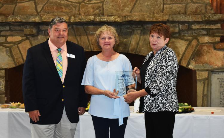 Georgia Municipal Association Member Services Consultant Stan Brown, left, and Director of Members Services Pam Helton, right, congratulate Cornelia City Clerk Janie Henderson, middle, for receiving the Lifetime Achievement Award. CHAMIAN CRUZ/Staff