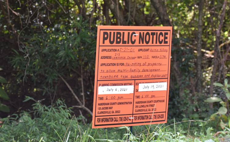 Signs like these are put up when a public hearing is scheduled about a potential zoning change. MATTHEW OSBORNE/Staff