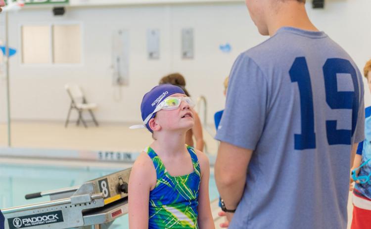 Caden Griffis gives instructions to a swimmer during camp at Tallulah Falls School last week. E. LANE GRESHAM/Special