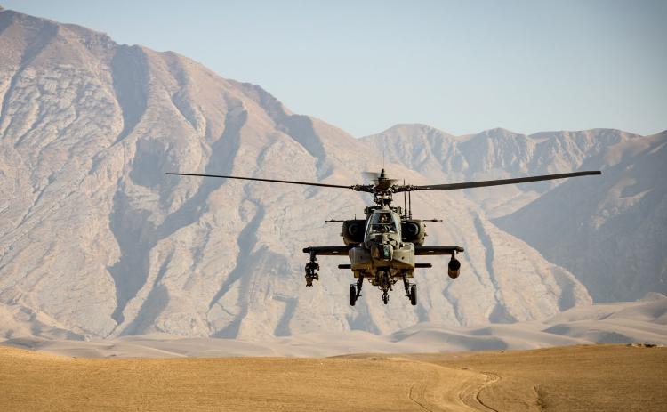 An American Apache helicopter flies through Afghanistan earlier this year. ANDRE KLIMKE/Unsplash