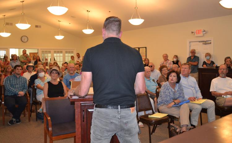 Lew Oliver presents his master plan to a room packed with Clarkesville residents on July 29. BRIAN WELLMEIER/Staff