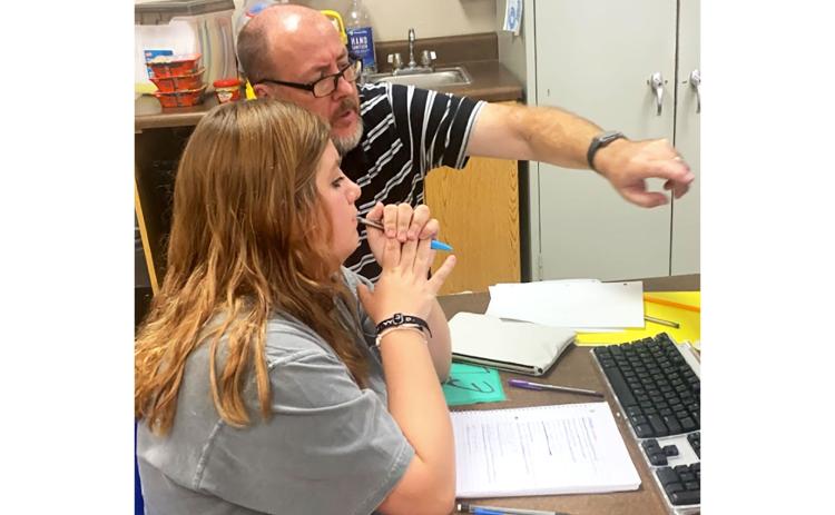 Teacher Karl Mealor works directly with student Karah Hicks at Mountain Education Charter High School’s Habersham County site. JENNIFER GLOVER/Submitted