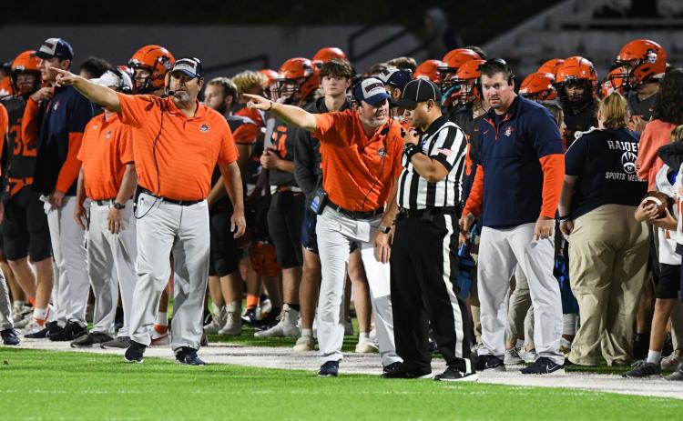 Habersham Central coach Benji Harrison points out a possible discrepancy with the official during Friday night’s game against Winder-Barrow. TOM ASKEW/Special