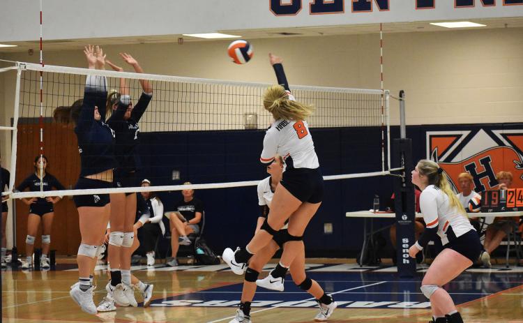 Habersham Central’s Landrey Pike goes for the kill at the net against West Hall on Thursday night. CODY ROGERS/Staff