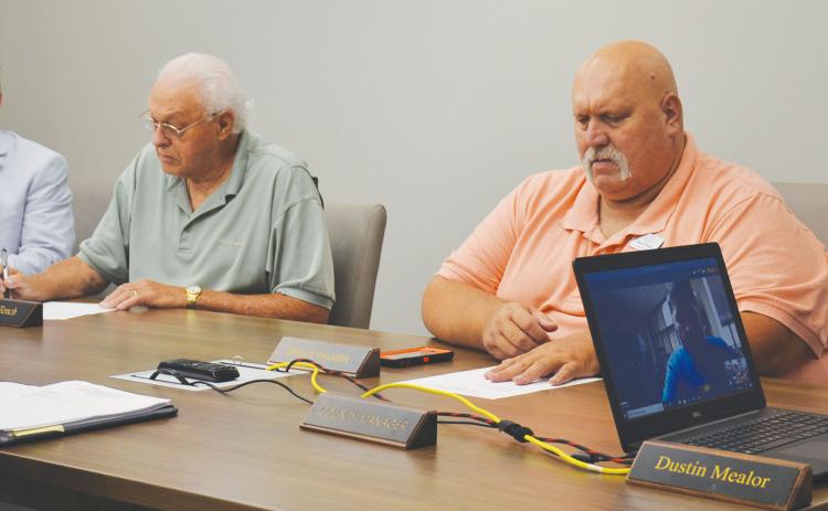 Habersham County Commissioners Bruce Palmer (right) and Jimmy Tench participate in a work session in June.