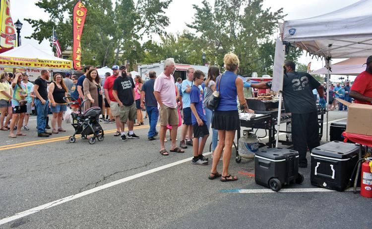 Folks enjoy the vendors at the 2019 Big Red Apple Festival in Cornelia.