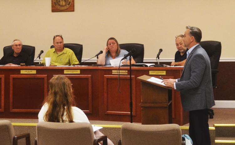 Fletcher Holliday of EMI speaks to the Baldwin Council on Wednesday night. BRIAN WELLMEIER/Staff