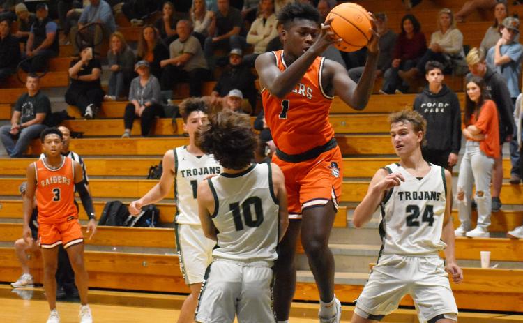 Habersham Central’s Bryce Pittman makes contact with a North Hall defender while driving to the basket during the Raiders scrimmage game. CODY ROGERS/Staff