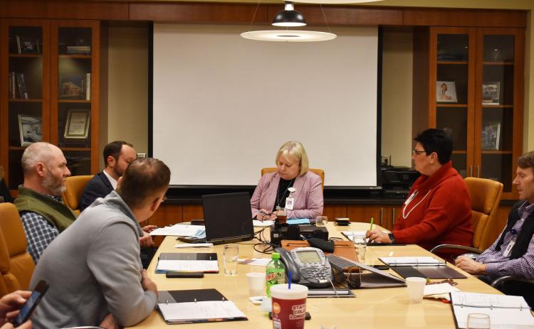 From left: Hospital Authority Board Members Tyler Williams, CEO, Habersham Medical Center, Josh Garrett, Hospital Board Authority Member, Andy Anderson, Hospital Board Authority Member, Dollie Ritchie, Chair, Hospital Board Authority, Teri Newsome, Hospital Board Authority Member, Ken Johnson, Hospital Board Authority Member discuss business during a Tuesday evening meeting. BRIAN WELLMEIER/Staff