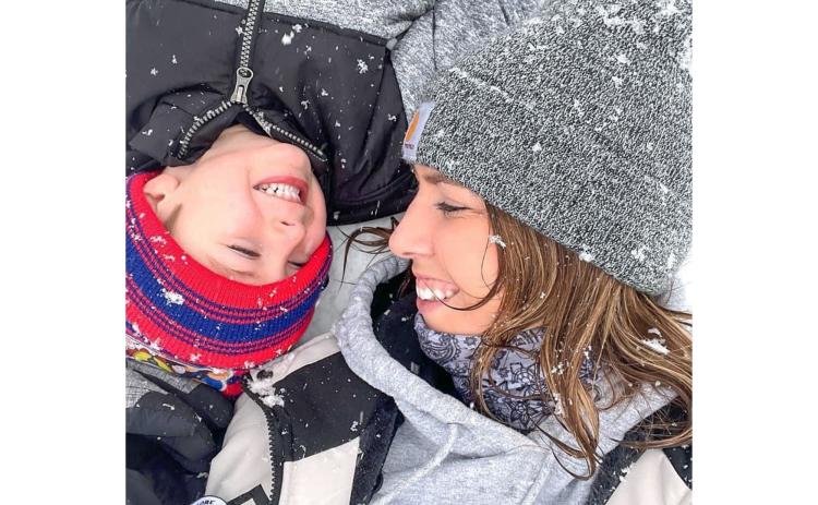 J.J. and his mom Ally Sosebee enjoy the snow in Mud Creek over the weekend. VICKI VINSON/Submitted