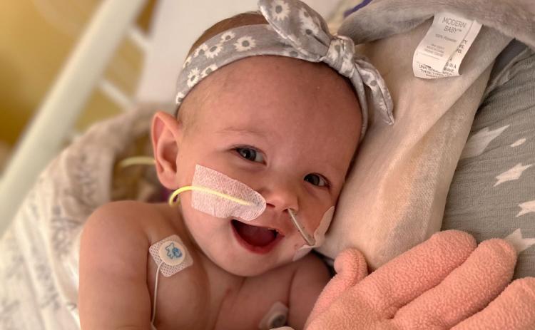 Little Halibell has had few moments to smile like this one last weekend, as she has battled health issues for most of her 6-month life so far. SABRINA MORALES/Submitted