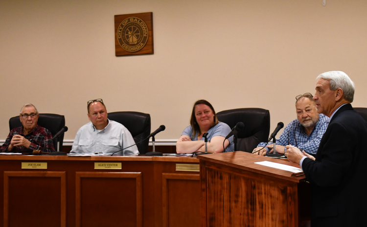Partnership Habersham Director Charlie Fiveash (right) makes his pitch Monday to Baldwin City Council to stay in business together. BRIAN WELLMEIER/Staff