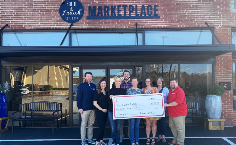 Farm & Lavish Marketplace receives its check with (from left) Brennt Cody, Cagney Meads, Brenda Williams, Heath Barrett, Alice Dover, Jessie Owensby, Sarah Higgins, and Jason Tanner attending. CITY OF CORNELIA/Submitted