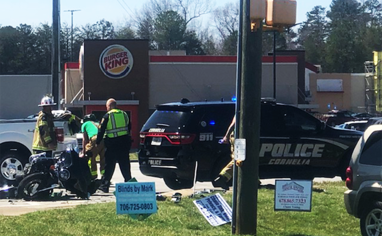 Responders work the scene of a motorcycle accident near the Cornelia Burger King on Monday afternoon. AMARIS E. RODRIGUEZ/Staff